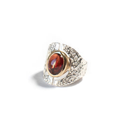Mixed metal open oval garnet cabochon ring